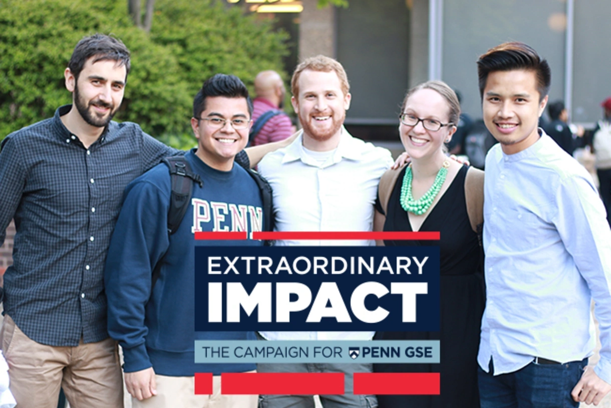 A group of Penn GSE students pose together in the Penn GSE courtyard. The Extraordinary Impact logo is on the bottom of the image. 