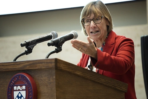 Pam Grossman speaking at a podium