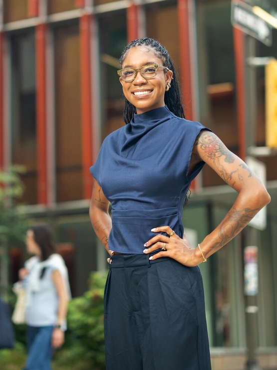 Madison McTier poses in front of the Penn GSE main building.