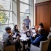 Students gather together at a table