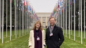 Taylor Hausburg and Zachary Herrmann pose in front of the UN