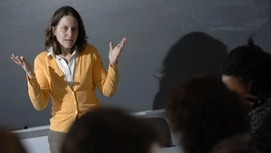 Sigal Ben-Porath standing in front of blackboard