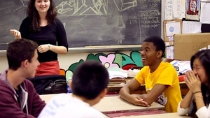 Teacher in classroom talking to students